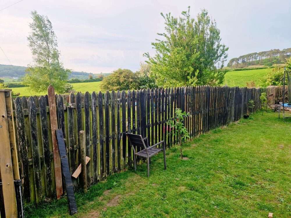 Garden transformed with fresh artificial grass, shed and play area